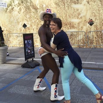 Times Square - Red Stairs - This tourist won't forget her trip to Times Square. Posted 10/18/19 - Landmarks & Historical Buildings Near Me Times Square - Red Stairs - This tourist won't forget her trip to Times Square. Posted 10/18/19 - Landmarks & Historical Buildings Near Me