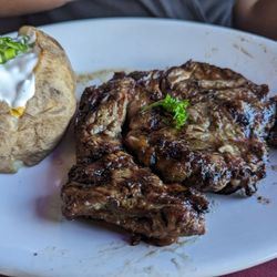 Red Flame Steak & Grill - Ribeye with loaded baked potatoes