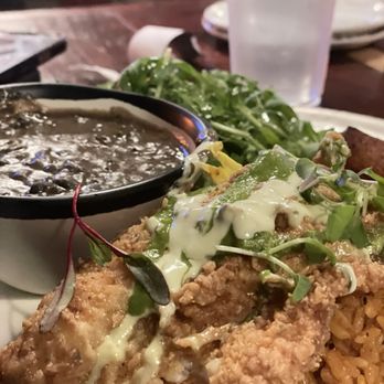 Two Hommés - Catfish and Jollof rice, arugula, salad, and planting - African Near Me - Inglewood, California Two Hommés - Catfish and Jollof rice, arugula, salad, and planting - African Near Me - Inglewood, California