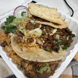 Asada soft tacos with rice and beans Asada soft tacos with rice and beans