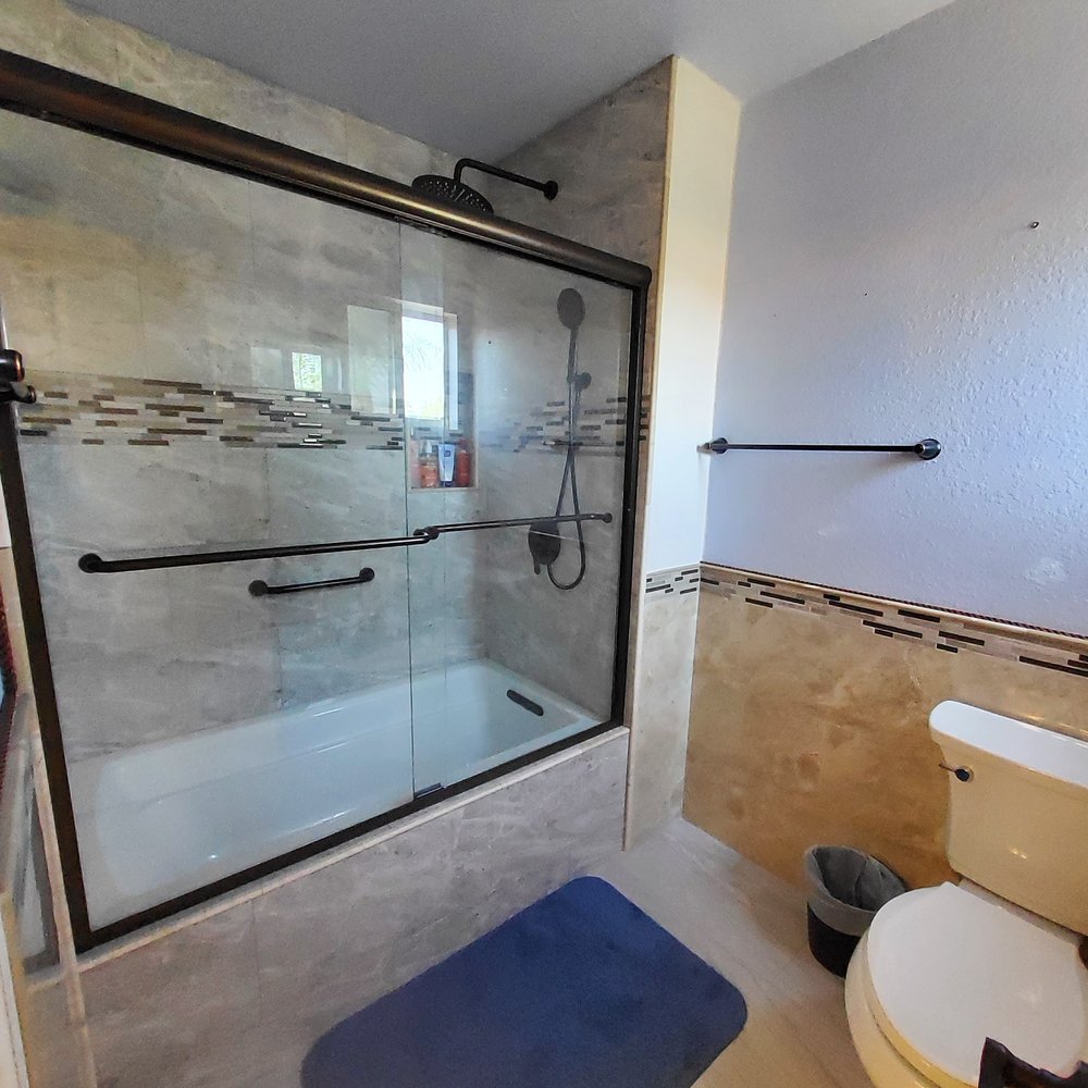 JM Custom Tile and Stone - Upstairs Second Bathroom enclosed Bathtub and Toilet - Flooring Near Me - Riverside, California JM Custom Tile and Stone - Upstairs Second Bathroom enclosed Bathtub and Toilet - Flooring Near Me - Riverside, California