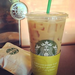 Warm slice of pumpkin bread with an iced coffee. Warm slice of pumpkin bread with an iced coffee.