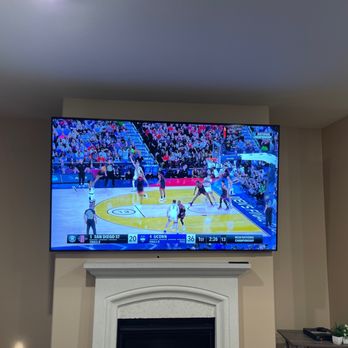 TV Wall Mounters - 85 inch TV mounted and displayed over fireplace. - TV Mounting Near Me TV Wall Mounters - 85 inch TV mounted and displayed over fireplace. - TV Mounting Near Me