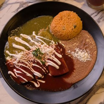 Frida’s Mexican Cantina - Chicken Enchiladas with Green and Red Sauce. Beans and Rice - Mexican Near Me - Charlotte, North Carolina Frida’s Mexican Cantina - Chicken Enchiladas with Green and Red Sauce. Beans and Rice - Mexican Near Me - Charlotte, North Carolina