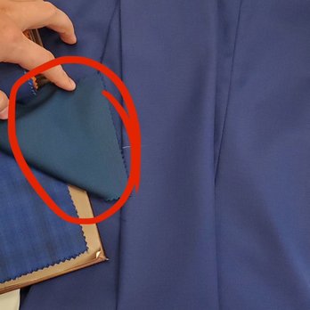 American Bespoke Tailor - The swatch circled in red is what we ordered for the jacket and pant. The blue pant behind is the incorrect suit from our first fitting. - Bespoke Clothing Near Me - Bellevue, Washington