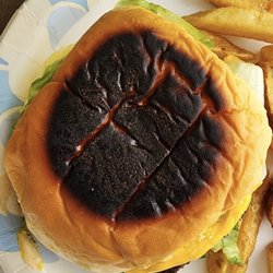 Bella's Burger Shack - LOL! My "toasted" bun! Burger was dry, small and thin. Topping made it a mess. Yuk!