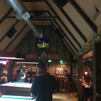 Three Needs Taproom & Brewery - a man playing pool - Breweries Near Me - Burlington, Vermont Three Needs Taproom & Brewery - a man playing pool - Breweries Near Me - Burlington, Vermont