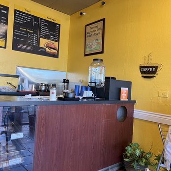 Fresno Bagel - a woman sitting at a counter - Bagels Near Me - Fresno, California Fresno Bagel - a woman sitting at a counter - Bagels Near Me - Fresno, California