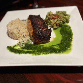 Polo Steak and Sea - Salmon with cilantro rice and guacamole and tomatoes mix - Steakhouses Near Me - Vero Beach, Florida Polo Steak and Sea - Salmon with cilantro rice and guacamole and tomatoes mix - Steakhouses Near Me - Vero Beach, Florida