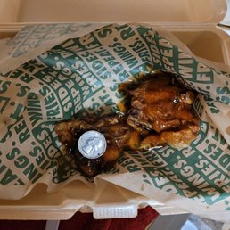 Two thighs!?! Yep. Orange Szechuan thighs. Yes that is a Quarter on top. Two thighs!?! Yep. Orange Szechuan thighs. Yes that is a Quarter on top.