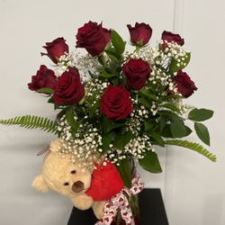 Isabel Florist - Be Mine - A beautiful red rose arrangement adorned with not only ribbon but also a bear!