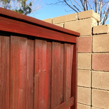 Ewing Painting - This old section of fence had been stained twice before. Again, they applied two coats of stain. See how they avoided overspray on the wall? - Painters Near Me - Beaumont, California