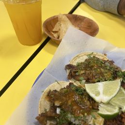 Al Pastor (left), chorizo (right cut off). Mango agua Fresca Al Pastor (left), chorizo (right cut off). Mango agua Fresca