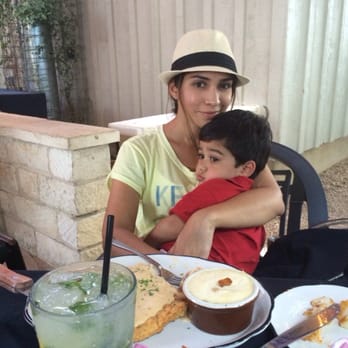 Moonshine Grill - Wife & baby snacking on grits. - Southern Near Me - Austin, Texas Moonshine Grill - Wife & baby snacking on grits. - Southern Near Me - Austin, Texas