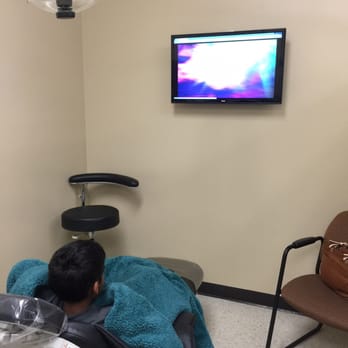 Aqua Dental - My son watching Netflix with a blanket. They made sure he was comfortable. - Cosmetic Dentists Near Me - Pearland, Texas