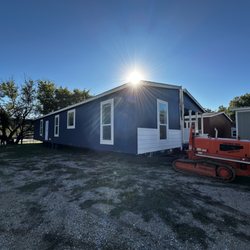 Premier MHS - A gorgeous shot of our tug spotting this home into a temporary location at the dealership.
