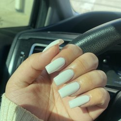 Solar Nails - Medium length, white colored nails.