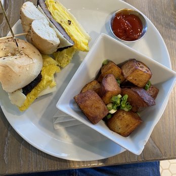 The Hen - Bagel, egg and cheese sandwich with potatoes - Breakfast & Brunch Near Me - Ann Arbor, Michigan The Hen - Bagel, egg and cheese sandwich with potatoes - Breakfast & Brunch Near Me - Ann Arbor, Michigan