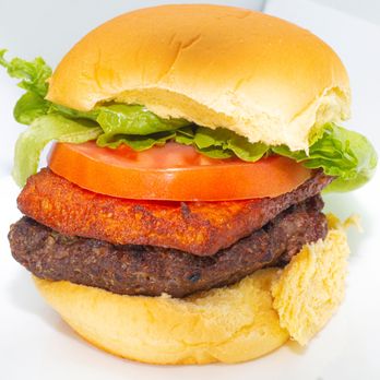 The Smoking Burger - the meat and tomato on the bun - Burgers Near Me - New York, New York The Smoking Burger - the meat and tomato on the bun - Burgers Near Me - New York, New York