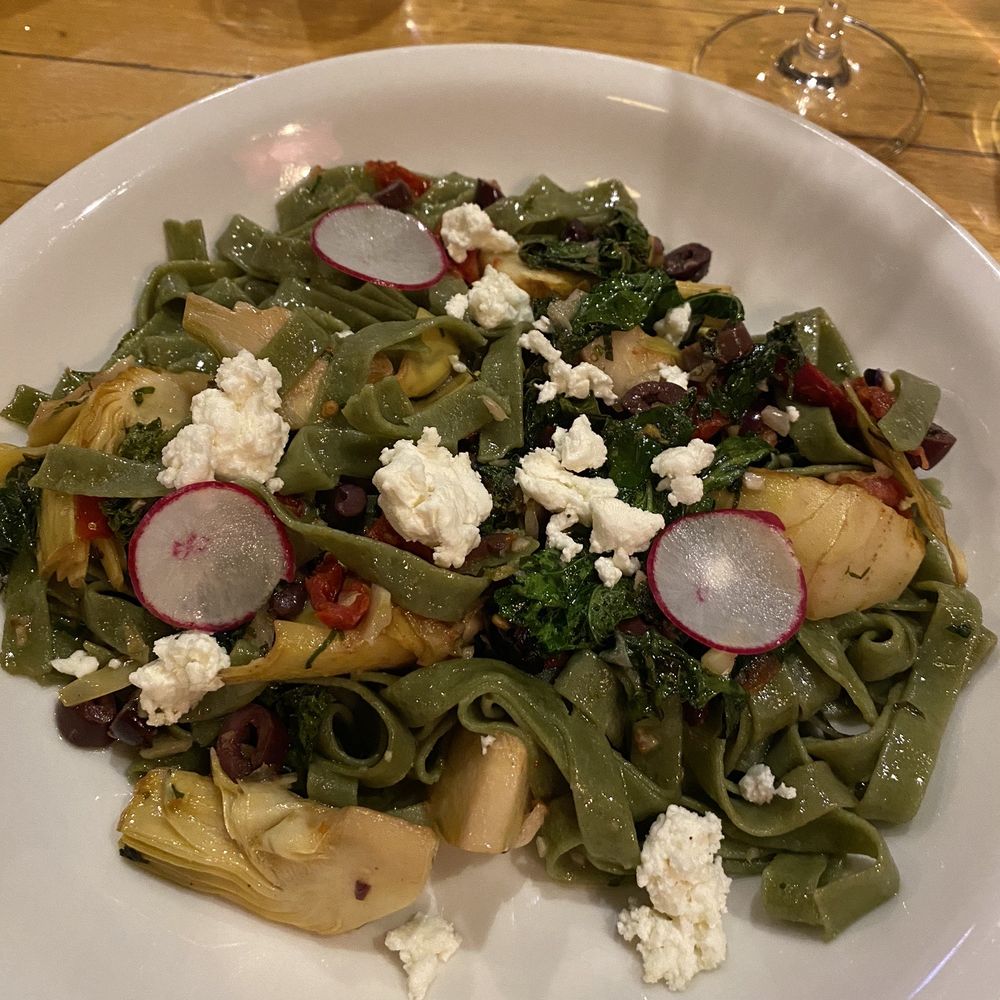 Mona Lisa's - Spinach pasta with artichokes and olives. Definitely add the feta cheese! - Italian Near Me - Eau Claire, Wisconsin Mona Lisa's - Spinach pasta with artichokes and olives. Definitely add the feta cheese! - Italian Near Me - Eau Claire, Wisconsin
