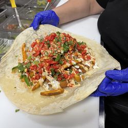 Man vs Fries - SoCal Asada Burrito with added Onion rings