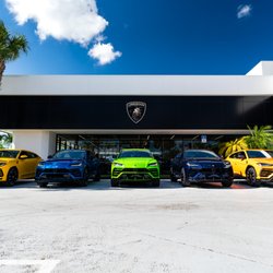 Lamborghini Palm Beach - 2021 Urus on display in front of Lamborghini Palm Beach