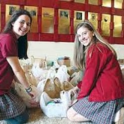 Elizabeth Seton High School - Community service is one of the required courses for graduation from Seton High. Here, two students assist with a food drive.
