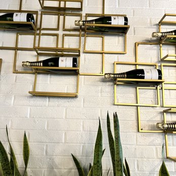 RBF, Your Authentic Champagne Bar - a wall of wine bottles - Wine Bars Near Me - Cary, North Carolina