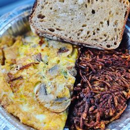 n omelet, hash browns, and bread