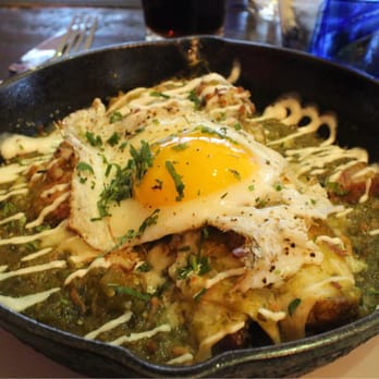 Nada - Green chile pork enchiladas with egg. - Mexican Near Me - Cincinnati, Ohio