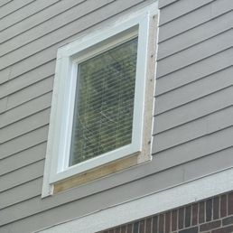 Two boards installed around the window were not primed. Board on left rotted, but not replaced.