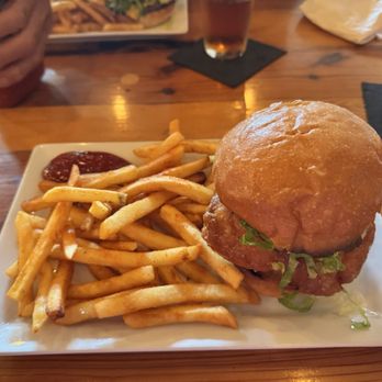 Tap 30 - Fried Chicken Sandwich. It's tasty and the bun is toasted. I love crunchy stuff. - Bars Near Me - Petoskey, Michigan