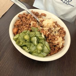 Pork belly over rice and cucumbers Pork belly over rice and cucumbers