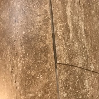 Comfort Suites - Broken tile where I slit my foot open. Didn't care! - Hotels Near Me - Mineral Wells, Texas
