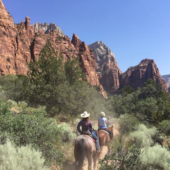 Canyon Trail Rides - Stunning views on Sand Bench Trail. One of our guides Jess. - Horseback Riding Near Me - Tropic, Utah Canyon Trail Rides - Stunning views on Sand Bench Trail. One of our guides Jess. - Horseback Riding Near Me - Tropic, Utah
