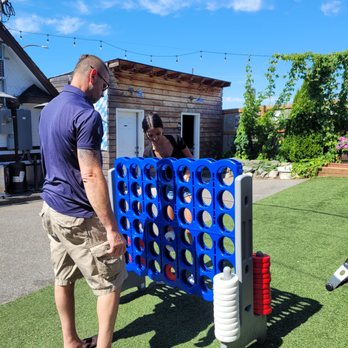 Schweinhaus Biergarten - A game of Connect Four on a sunny day. - German Near Me - Bellingham, Washington Schweinhaus Biergarten - A game of Connect Four on a sunny day. - German Near Me - Bellingham, Washington