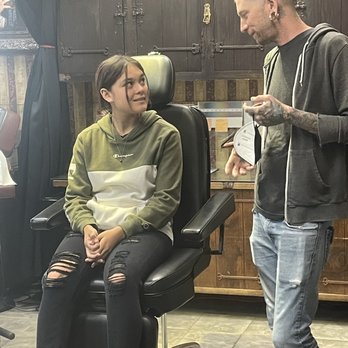 Studio City Tattoo - My daughter listening to the process of ear piercing and education given by Steve. He was so great with her and really eased her anxiety. - Tattoo Near Me - Studio City, California