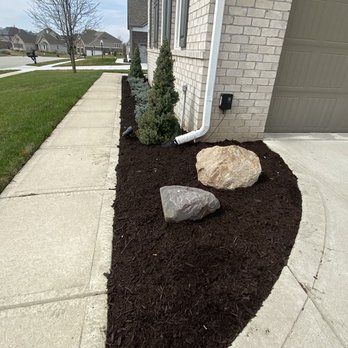 Morales Construction & More - the front of a house with a rock in the front yard - Irrigation Near Me Morales Construction & More - the front of a house with a rock in the front yard - Irrigation Near Me
