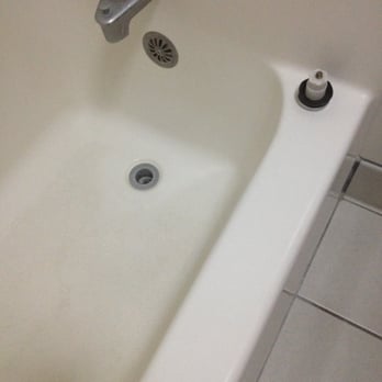 Oak Tree Inn - Gross bath tub with the drain sitting on the edge on the tub... - Hotels Near Me - North Platte, Nebraska Oak Tree Inn - Gross bath tub with the drain sitting on the edge on the tub... - Hotels Near Me - North Platte, Nebraska