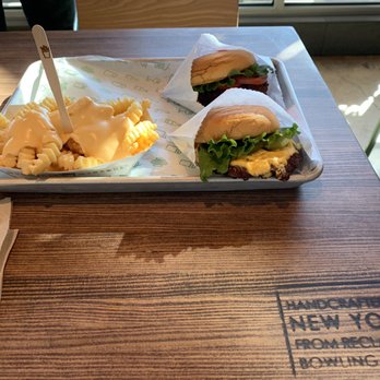 Shake Shack Metairie - ShackBurger (top), 'Shroom Burger (bottom), and Cheese Fries - Burgers Near Me - Metairie, Louisiana Shake Shack Metairie - ShackBurger (top), 'Shroom Burger (bottom), and Cheese Fries - Burgers Near Me - Metairie, Louisiana