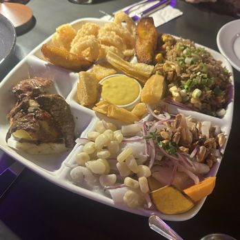 Moia Peruvian Restaurant - The Ronda Plate combination of Ceviche Mixto, Arroz Chaufa, Fried Calimar, Antiochus, and Fried Yuca. - Peruvian Near Me - Las Vegas, Nevada