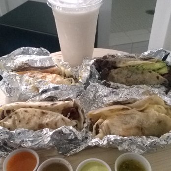 Tacodeli - A sampling of breakfast tacos and horchata to share. - Mexican Near Me - Dallas, Texas