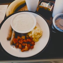 Novant Health Huntersville Medical Center - breakfast: scrambled egg, grits, turkey sausage, seasony taters, thin decaf coffee, cold water, hot water for tea, and a banana