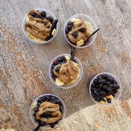 Acai muchos and one with extra blueberries instead of granola Acai muchos and one with extra blueberries instead of granola