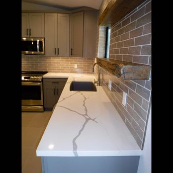 Marilyn Brody Design - Quartz countertops, reclaimed wood shelves. - Interior Design Near Me - La Quinta, California Marilyn Brody Design - Quartz countertops, reclaimed wood shelves. - Interior Design Near Me - La Quinta, California