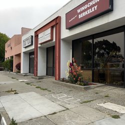 Billy's Hair Design - It's the store with the red archway next to the tattoo place.