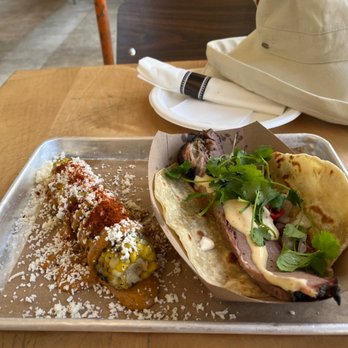 Hometown Bar-B-Que - Barbecue brisket on house-made flour tortilla with Mexican street corn. - Barbeque Near Me - Miami, Florida Hometown Bar-B-Que - Barbecue brisket on house-made flour tortilla with Mexican street corn. - Barbeque Near Me - Miami, Florida