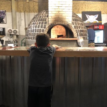 Richard's Brick Oven Pizza - Watching the pizza oven - Pizza Near Me - Franklin, Indiana Richard's Brick Oven Pizza - Watching the pizza oven - Pizza Near Me - Franklin, Indiana