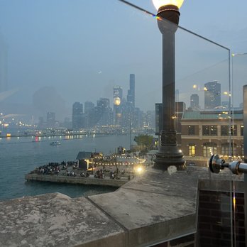 Offshore Rooftop - A view from the back patio. You can see the city skyline (this picture was taken when the air quality was poor from the Canadian fires) - New American Near Me - Chicago, Illinois