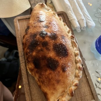 Pizza Pirata - Good for two people because it is a huge calzone (mozzarella and ricotta cheese) with red sauce on the side. - Pizza Near Me - San Juan, Puerto Rico Pizza Pirata - Good for two people because it is a huge calzone (mozzarella and ricotta cheese) with red sauce on the side. - Pizza Near Me - San Juan, Puerto Rico